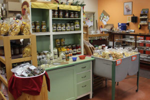 An image of a store with chips, bagged items and canned items.