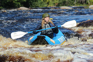 An image of a lady kayaking.