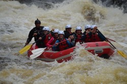 A picture of a group white water rafting.