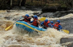 A picture of a group white water rafting.
